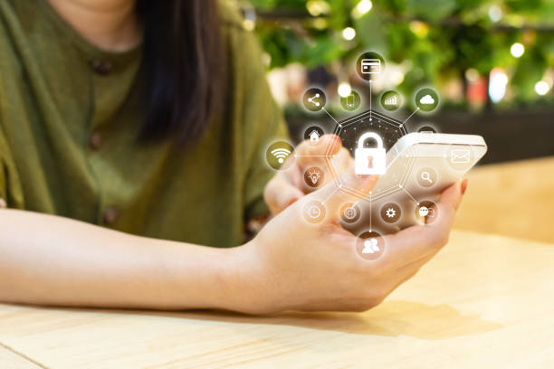 istock Data protection and security important information in your mobile phone, Woman hand using smartphone and icon key on shield 1133293102