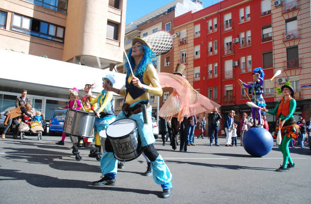 madrid, spain, march 2nd 2019: carnival parade, members of tabarilea percusion playing and dancing - traditional festival juggling women performer imagens e fotografias de stock