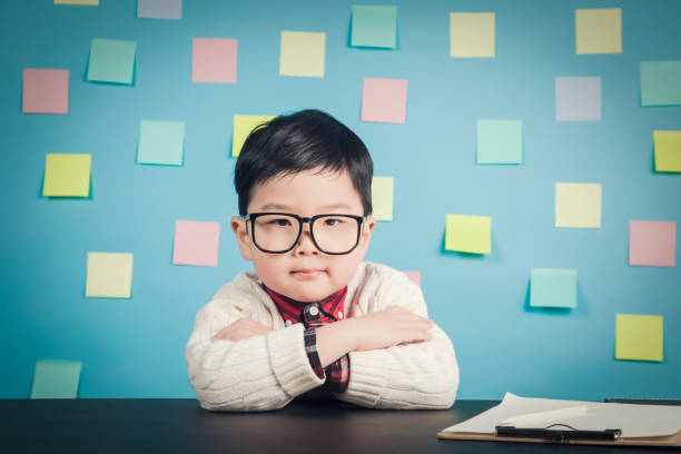 Young Nerd Business Boy in the Office Businessman, Japanese Ethnicity,Child, Nerd, China - East Asia office fun business adhesive note stock pictures, royalty-free photos & images