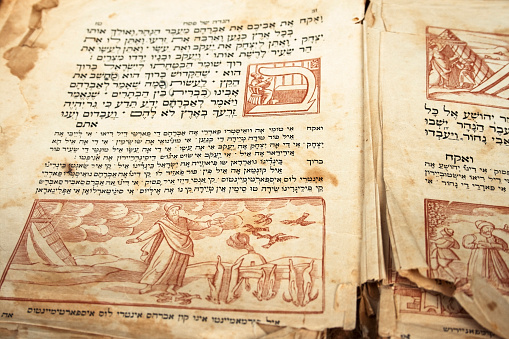 Close up view of an old page with stains of  Hagada book for Passover SEDER