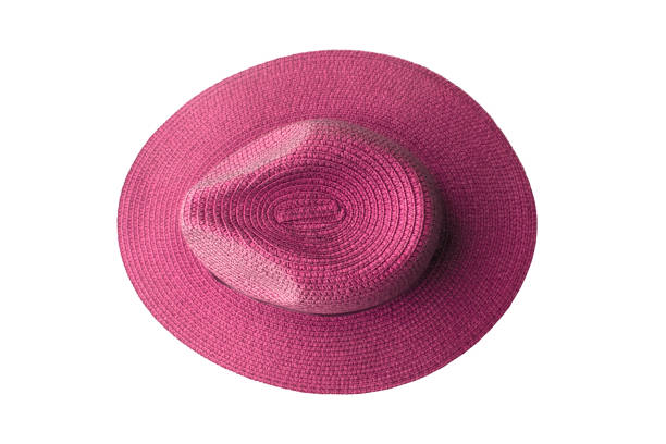 istock Top view pink pretty straw hat isolated on white background 1133298337