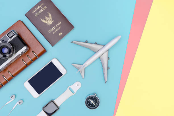istock travel objects and accessories on blue yellow pink background with passport camera and plane 1133299922