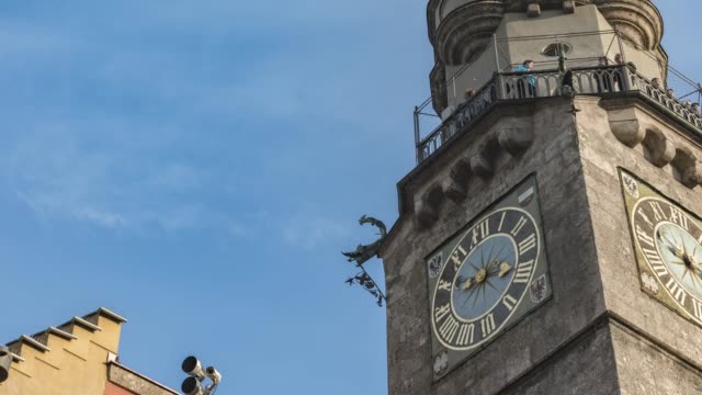timelapse of clock tower in famous in old town Innsbruck Austria with cloud sky
