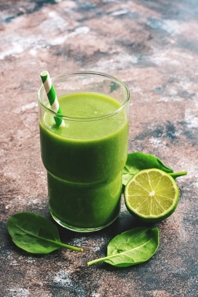 istock Healthy green vegan smoothie with spinach and lime. Selective focus , space for text. 1133313615