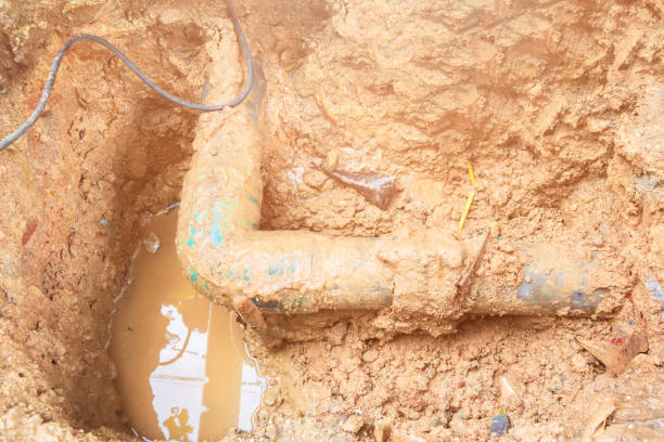 istock broken pipe in hole with water motion at roadside wait repair 1133316356