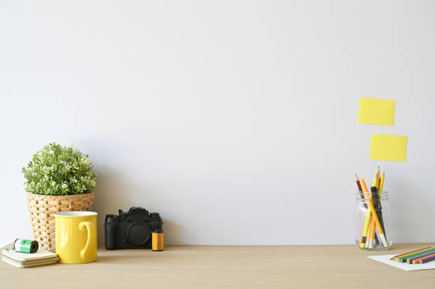 istock Creative workspace camera and office supplies on wood desk with copy space. 1133318730