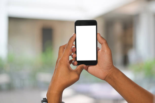 istock Mockup mobile phone on hands with blur background. 1133318864