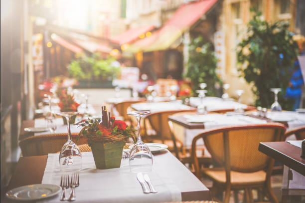Photo of a table set up at an outdoor restaurant on one of many side streets in the old section of Cannes, France along the Mediteranean.