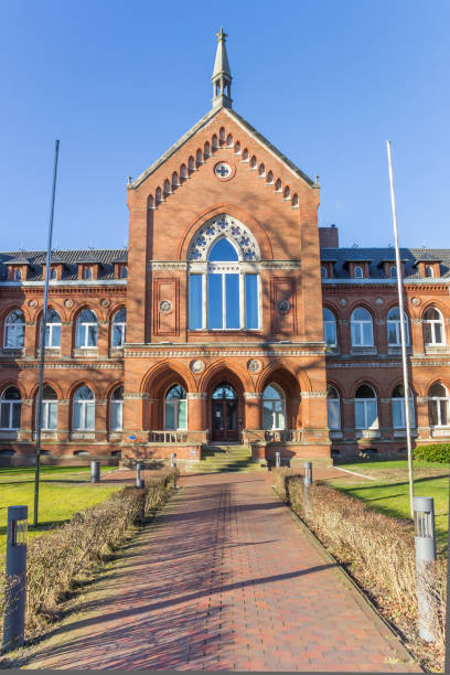 Path leading to the historic courthouse building in Varel, Germany