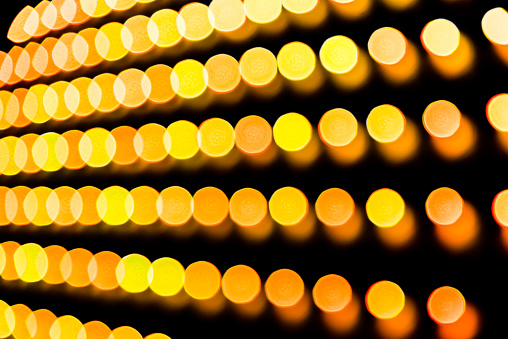 Rows of intentionally defocused lights for a bright high tech abstract background