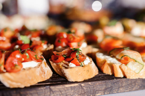 istock Food snack tray holiday buffet table served by different canape, sandwiches, snacks, nuts, peanuts ready for eating in restaurant 1133328126
