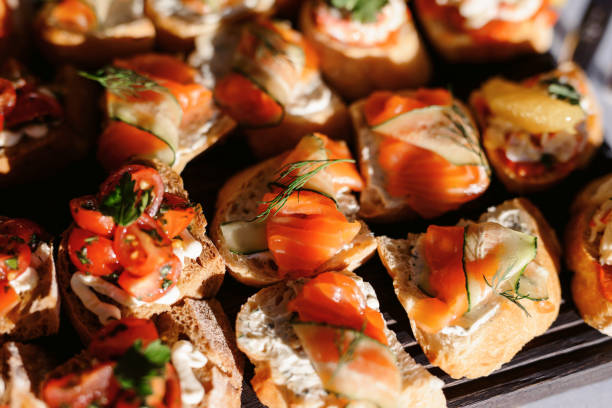 istock Food snack tray holiday buffet table served by different canape, sandwiches, snacks, nuts, peanuts ready for eating in restaurant 1133328131