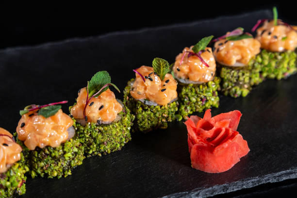 istock Set of sushi rolls on black background 1133328875