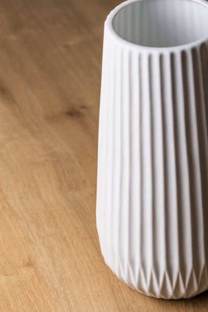 istock White modern design pot detail on a wood background 1133331684