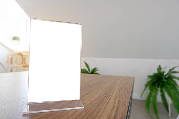 istock Menu frame standing on wood table in Bar restaurant cafe. space for text marketing promotion - Image 1133335704