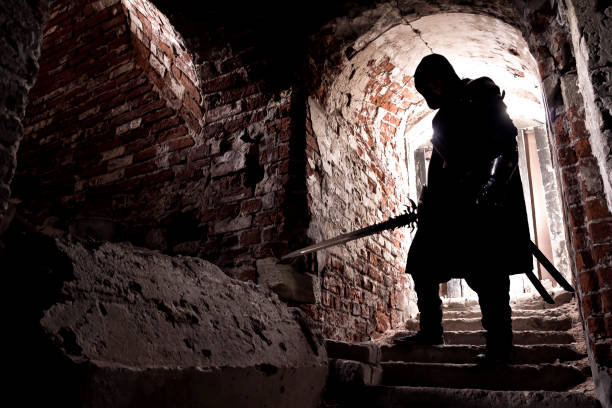 Warrior standing in forgotten and ruined fortress.