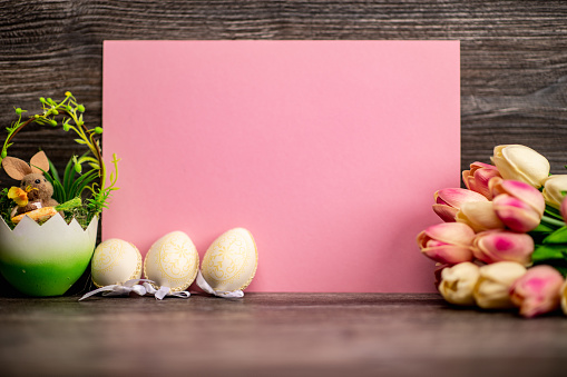 Easter greeting card with tulips .Easter,eggs, holidays and tradition concept.