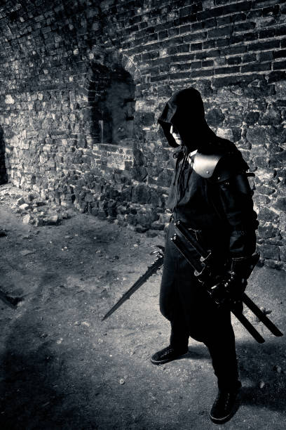 istock Warrior standing in forgotten and ruined fortress. 1133335762