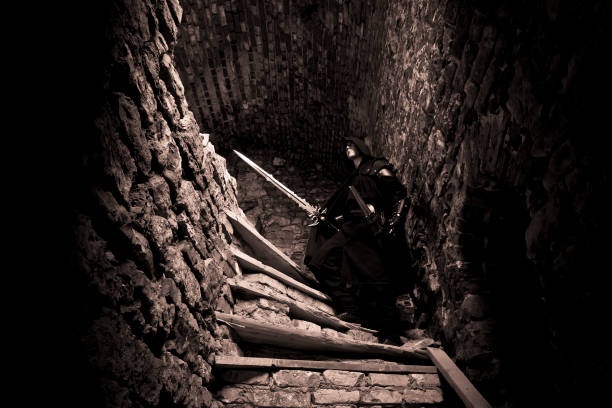 istock Warrior standing in forgotten and ruined fortress. 1133335772