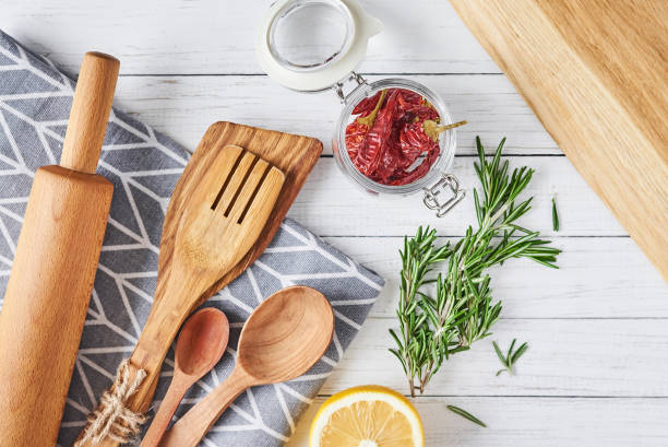 istock Kitchen utensils and cooking ingredients on a white wooden background, top view 1133338095