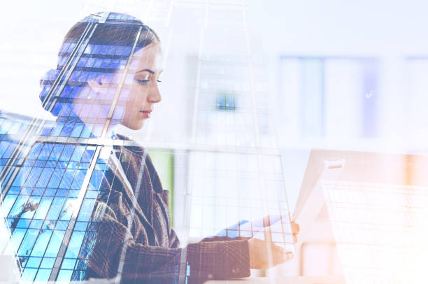 istock Serious woman with tablet, skyscraper 1133338533