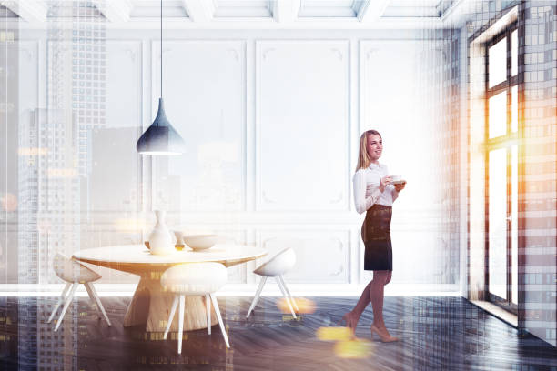 istock White dining room interior, round table, woman 1133338634