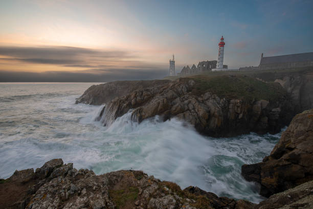 istock Lighthouse Pointe de Saint-Mathieu, sunset big waves, Brittany (Bretagne), France 1133346254