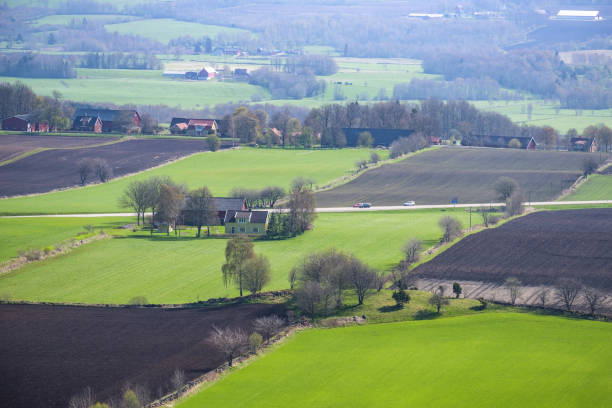 istock Rural view at spring over fields and farms 1133346306