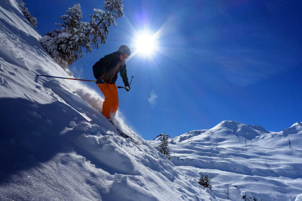 Male skier riding on a sunny day in the skiresort of St. Anton, Austria