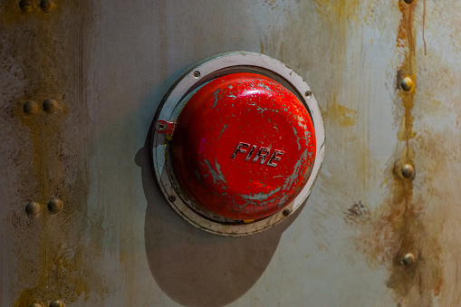 Old alarm systems, Classic vintage fire alarm bell on the wall of a submarine