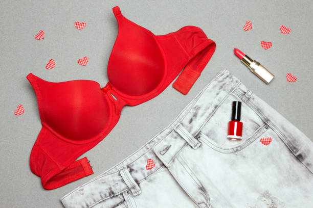 Fashion summer women clothing and accessories Denim shorts, bright red strapless bra, nail polish, lipstick. Fashion summer women clothing and accessories strapless stock pictures, royalty-free photos & images