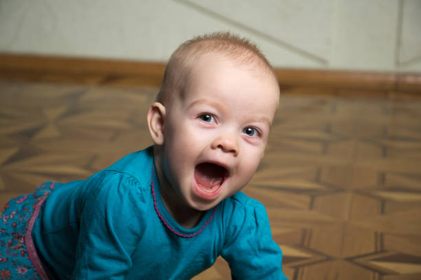 istock funny laughing child with mouth wide open 1133354604
