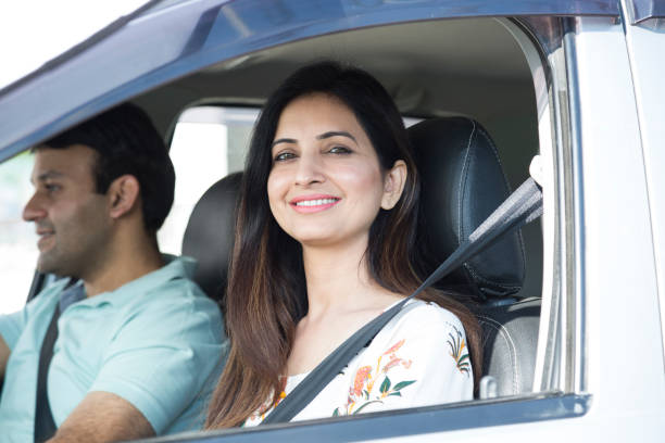 istock Young couple in car using pc tablet to navigate - Stock image 1133362011