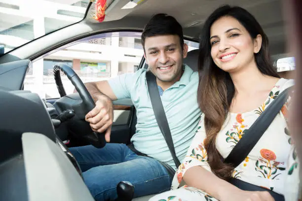 Photo of Happy couple going on a road trip - Stock image