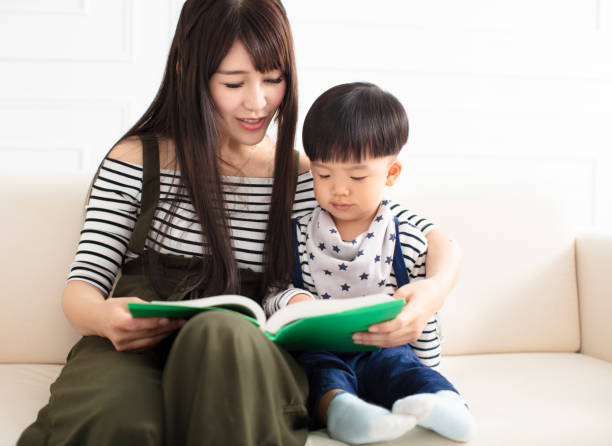 istock mother and son studying on the sofa 1133362663