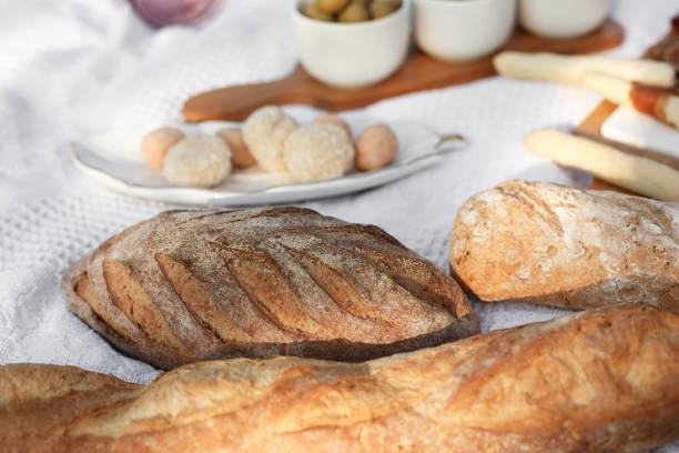 istock fresh baked bread on white blanket. bakery concept 1133362792