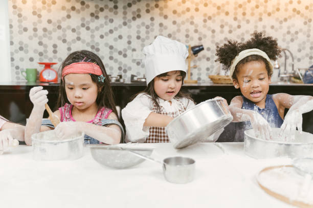 kids cooking bakery stock photo