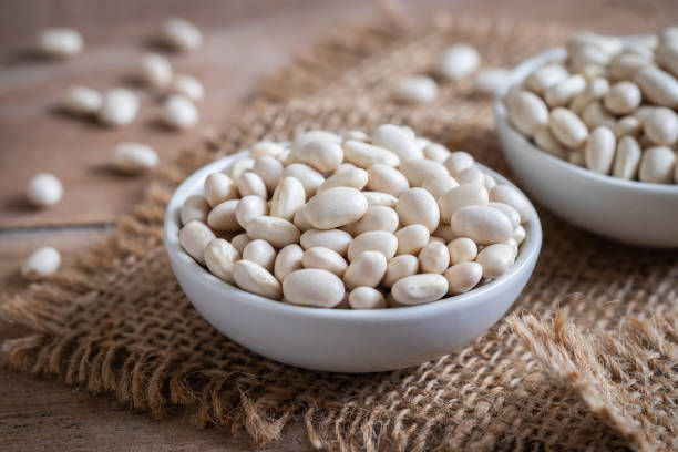 White bean in bowl White bean in bowl bean stock pictures, royalty-free photos & images