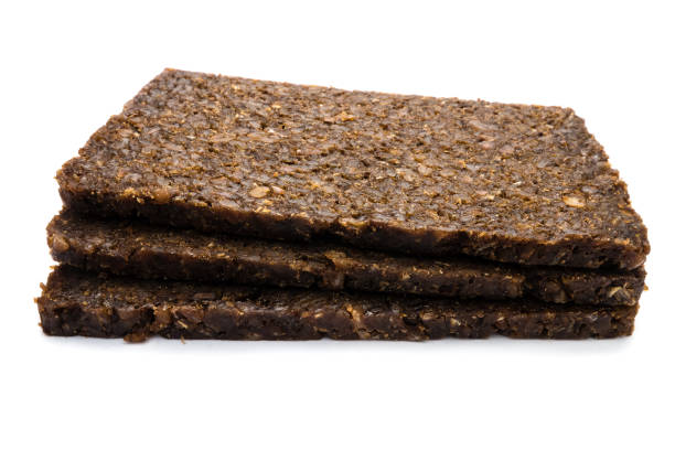 istock Pumpernickel bread isolated on white background 1133365438