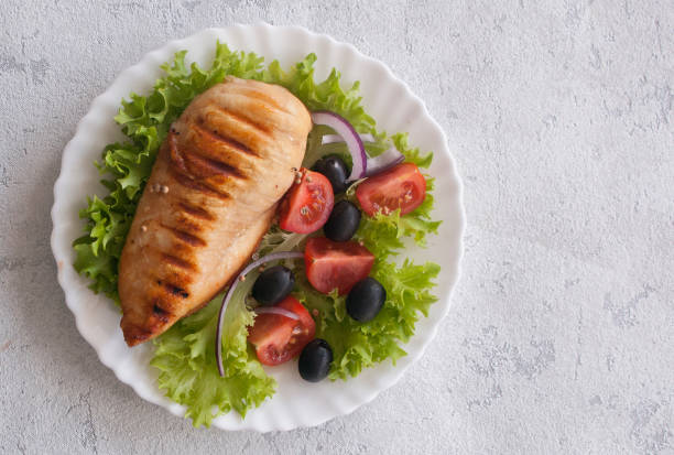 istock Grilled chicken breast with vegetable salad. The view from the top. Copy space. 1133366154