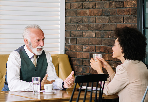 Business colleagues having coffee together