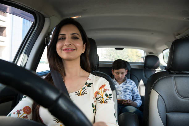 istock woman driving car 1133366925