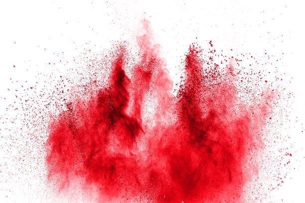 istock Red powder explosion on white background. Freeze motion of red dust particles splash. 1133368445