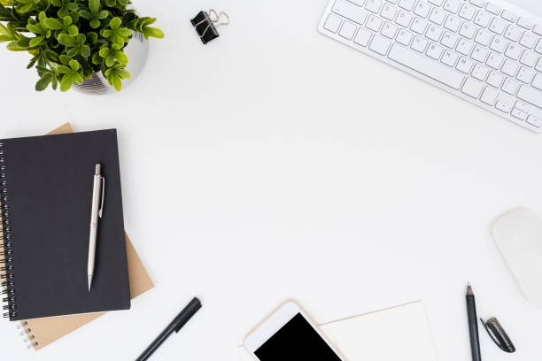 istock White office desk table with a lot of things on it. Top view with copy space, flat lay. 1133369028