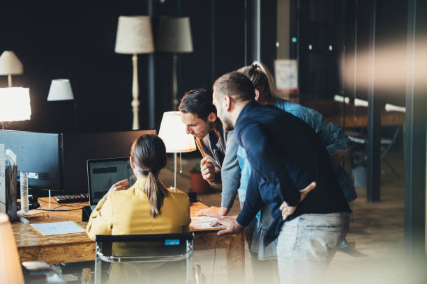 istock Group of people talking and working in office 1133371051
