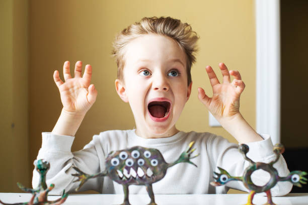 istock Little boy playing with Child's Play Clay 1133371280