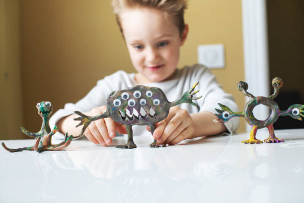 istock Little boy playing with Child's Play Clay 1133371293