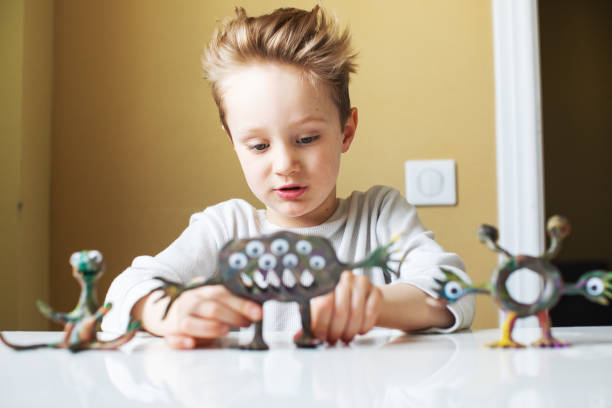 istock Little boy playing with Child's Play Clay 1133371310