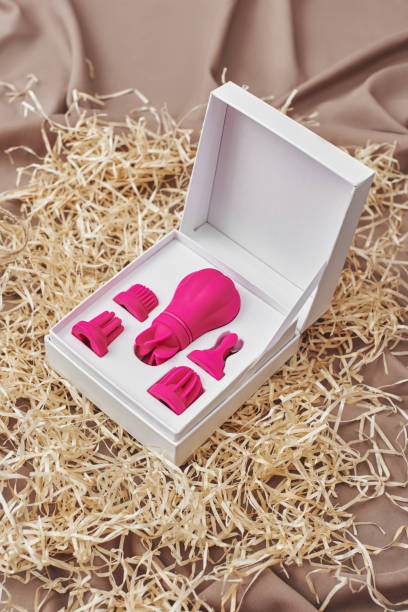 istock Made for clitoral orgasm. Close up of powerful silicone stimulator with different nozzles for it in white box 1133376473
