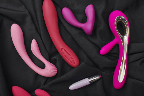 Adult gifts for couples. Close up photo of colorful various sex toys: dildos prostate massager, g-spot vibrators and others. stock photo